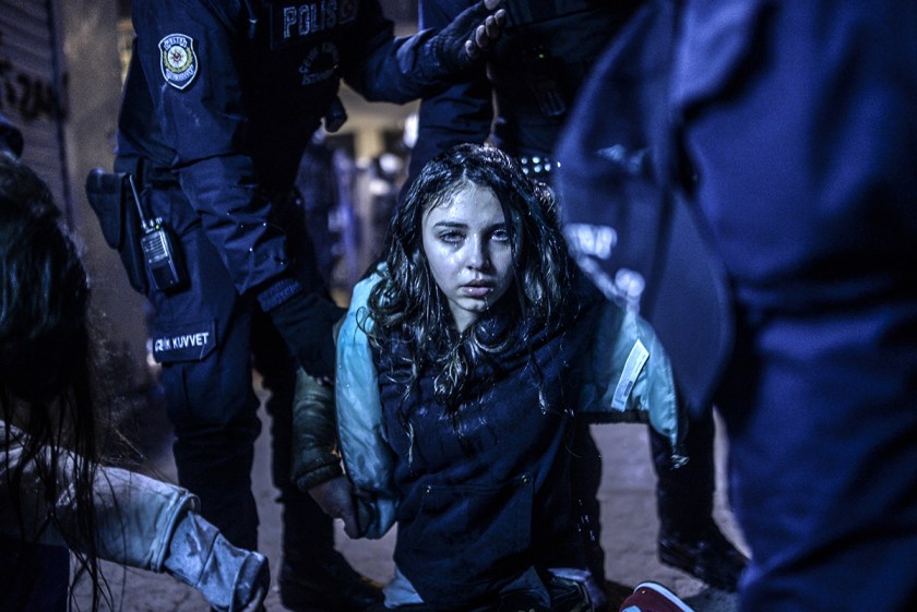 A young girl is pictured after she was wounded during clashes between riot-police and prostestors after the funeral of Berkin Elvan, the 15-year-old boy who died from injuries suffered during last year's anti-government protests, in Istanbul on March 12, 2014. Riot police fired tear gas and water cannon at protestors in the capital Ankara, while in Istbanbul, crowds shouting anti-government slogans lit a huge fire as they made their way to a cemetery for the burial of Berkin Elvan. AFP PHOTO/BULENT KILIC